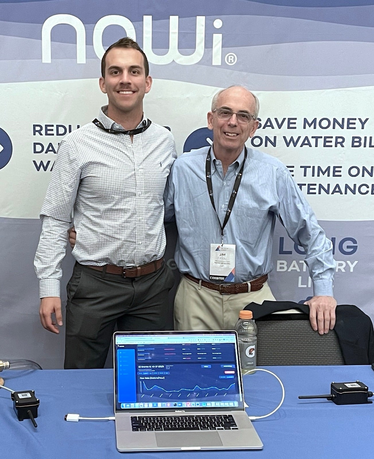 Charles and Jim Fayal, co-founders of NOWi Sensors, at a trade show booth